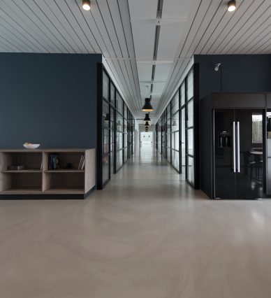 architectural photography of black and brown hallway